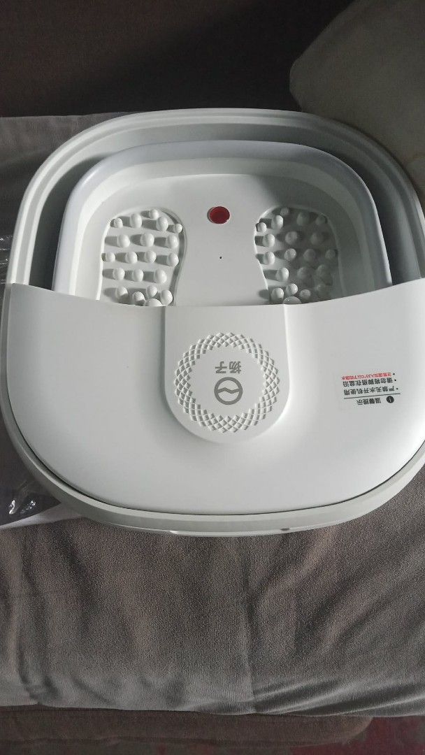 Folding Foot Bath Tub Massager (Category: Bathtub & Bath Accessories) located in Manila. Submitted by wisegem-231b (Listing ID 1470393822, Image 2). Description: - Electric folding foot bath tub with relaxing massage rollers - Space-saving collapsible design for easy storage - Plug-and-play operation for ultimate convenience at home - Comes with original box - Condition: Like new / Great for self-care.