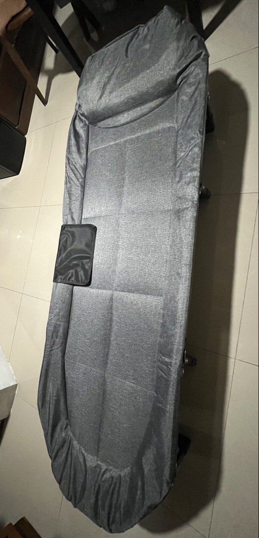 Fold-Out Bed Grey Portable Lounge Cot (Category: Bed Frames & Mattresses) located in Bacoor. Submitted by jazmarie (Listing ID 1470554045, Image 1). Description: - Brand new grey folding cot bed, still in the box - Built-in headrest and convenient side pocket for essentials - Sturdy metal frame that folds down compactly - Easy to store under desks or in tight spaces - Ideal for office naps, camping trips, or unexpected house guests 55x170.