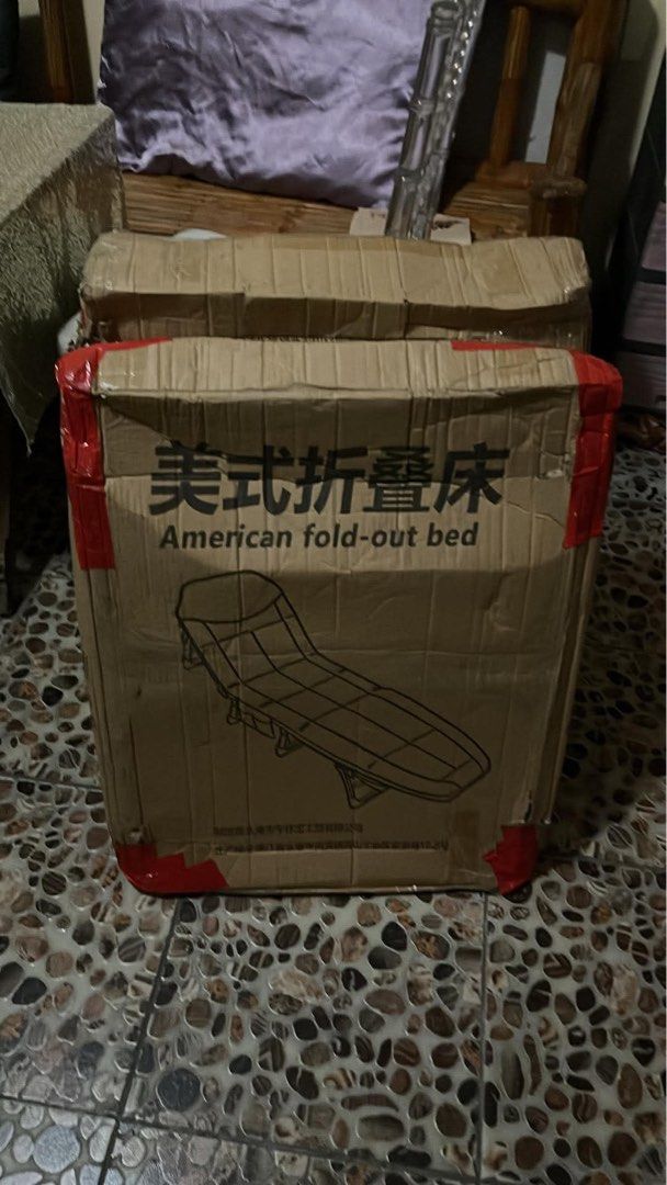 Fold-Out Bed Grey Portable Lounge Cot (Category: Bed Frames & Mattresses) located in Bacoor. Submitted by jazmarie (Listing ID 1470554045, Image 3). Description: - Brand new grey folding cot bed, still in the box - Built-in headrest and convenient side pocket for essentials - Sturdy metal frame that folds down compactly - Easy to store under desks or in tight spaces - Ideal for office naps, camping trips, or unexpected house guests 55x170.