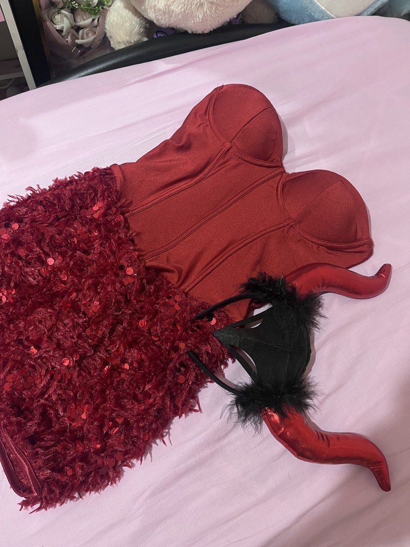 FOR RENT//Halloween Devil Costume (Category: Dresses) located in Manila. Submitted by ley_luvss (Listing ID 1470461588, Image 1). Description: - Color: Stunning red - Style: Strapless dress with structured corset-style bodice and sequined feathered skirt - Inclusions: Matching devil horns headband with fluffy black trim and furry black gloves - Perfect for: Halloween parties, cosplay, costume events, or clubbing - Features: Eye-catching sequins t