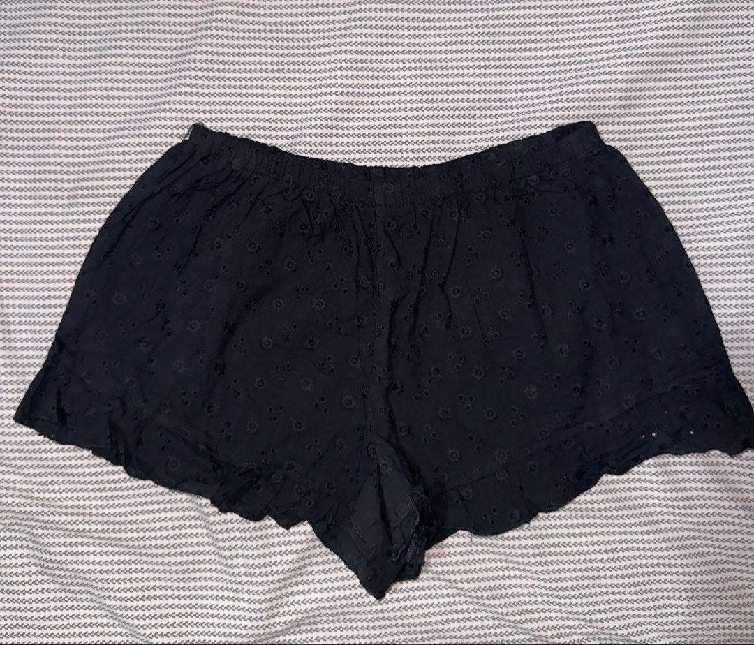 Forever 21 Black Eyelet Ruffle Shorts (Category: Shorts) located in Santa Ana. Submitted by fatikilla (Listing ID 1470378743, Image 1). Description: - Brand: Forever 21 - Size: S (tag indicated) - Color: Black - Design: Allover eyelet pattern with ruffle hem detail - Waist: Elastic waistband for easy pull-on fit - Fabric: Lightweight, ideal for warm weather days - Condition: Excellent.
