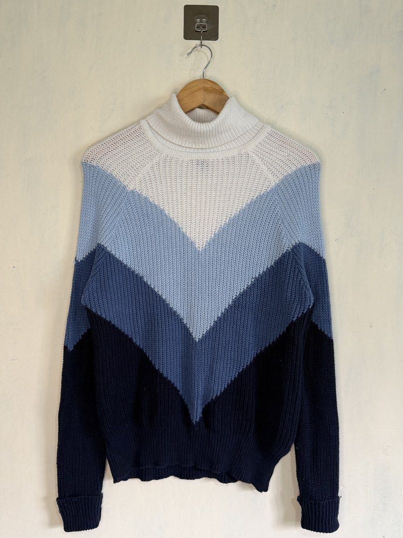Forever 21 Colorblock Turtleneck Sweater Size S (Category: Longsleeves) located in Manila. Submitted by snipe.shit (Listing ID 1470423545, Image 1). Description: - Brand: Forever 21 - Style: Turtleneck sweater with colorblock stripes (blue, navy, white) and chevron chest pattern - Size: Small - Material: 60% cotton, 40% acrylic (thick knit fabric) - Features: Long sleeves with folded cuffs - Care: Hand wash cold - Condition: Brand new with tag at