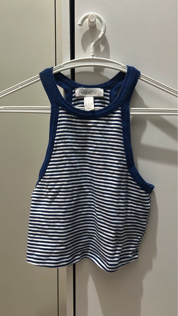 Forever 21 Crop Tops Bundle - Set of 4 (Category: Sleeveless) located in Manila. Submitted by wonderwoman_023 (Listing ID 1470387965, Image 3). Description: - Brand: Forever 21 - Quantity: Set of 4 trendy crop tops - Items included: White polka dot ruched tee, blue & white striped high-neck tank, black & white striped off-shoulder long sleeve, and olive green floral spaghetti strap top - Style: Casual, perfect for mix-and-match everyday outfits -