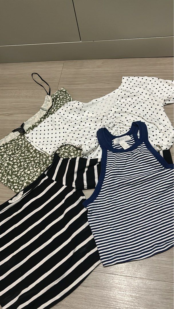 Forever 21 Crop Tops Bundle - Set of 4 (Category: Sleeveless) located in Manila. Submitted by wonderwoman_023 (Listing ID 1470387965, Image 1). Description: - Brand: Forever 21 - Quantity: Set of 4 trendy crop tops - Items included: White polka dot ruched tee, blue & white striped high-neck tank, black & white striped off-shoulder long sleeve, and olive green floral spaghetti strap top - Style: Casual, perfect for mix-and-match everyday outfits -