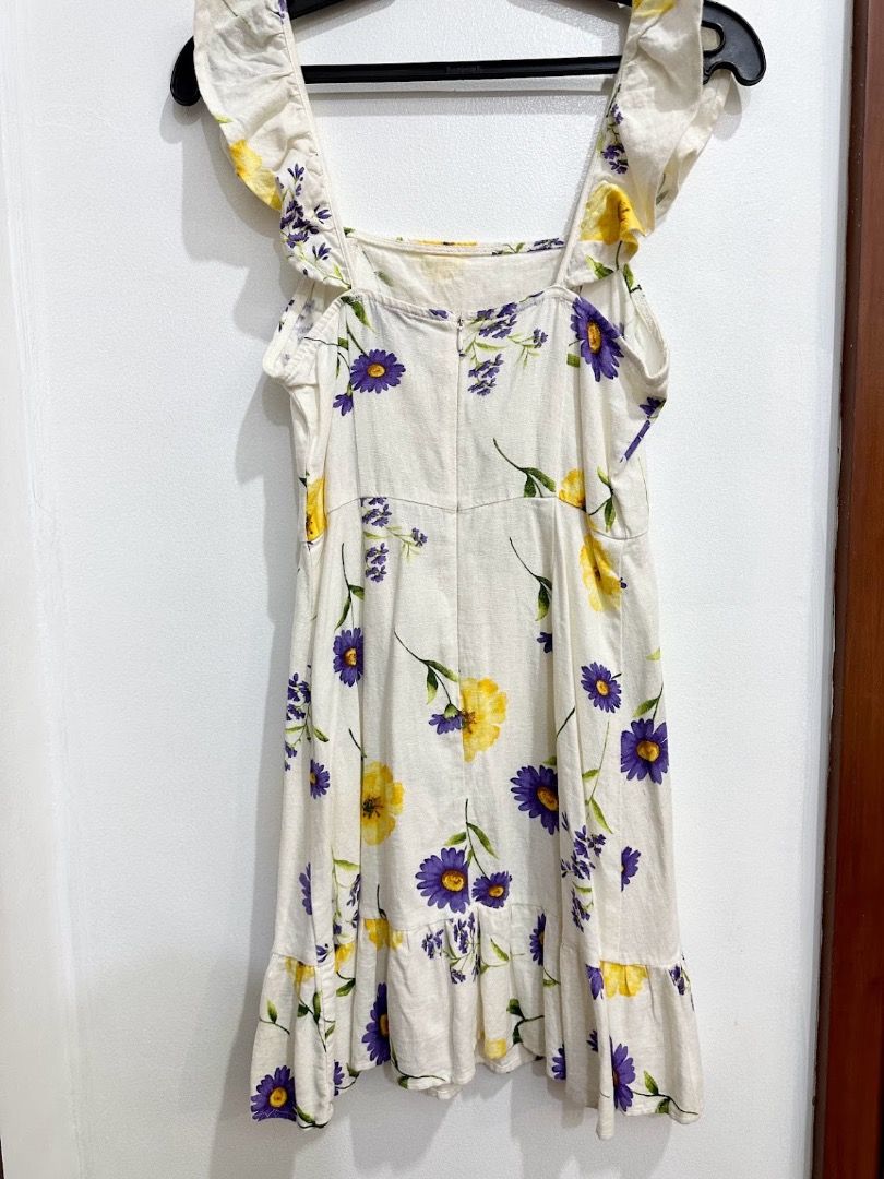 Forever 21 Floral Sundress Size S (Category: Dresses) located in Quezon City. Submitted by decluttering_alot (Listing ID 1470424814, Image 2). Description: - Brand: Forever 21 - Size: S - Color: Cream with yellow & purple floral print - Design: Square neckline, wide ruffle straps, fitted bodice, flared skirt, ruffled hem - Material: Lightweight textured fabric (ideal for warm weather) - Closure: Back zipper RFS: used once, closet cleanup.