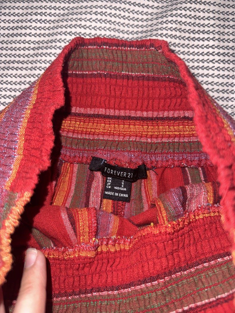 Forever 21 Multi-colored Striped Smocked Shorts Size S (Category: Shorts) located in Santa Ana. Submitted by fatikilla (Listing ID 1470465240, Image 2). Description: - Brand: Forever 21 - Size: Small - Color/Pattern: Red with multicolored vertical stripes - Waistband: Thick smocked elastic for a stretchy, comfortable fit - Design: Flowy, skirt-like silhouette - Fabric: Lightweight and ideal for warm weather.
