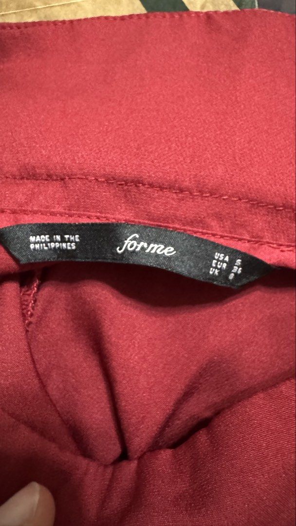 Forme Maroon Tailored Trousers Size S (Category: Jeans) located in San Pedro. Submitted by abbbnnn (Listing ID 1470414495, Image 3). Description: - Brand: Forme - Color: Maroon - Size: USA 4 | EUR 36 | UK 8 - Material: 89% Polyester, 11% Spandex (Comfortable stretch fabric) - Origin: Made in the Philippines - Style: High-waisted with front pleats, belt loops, and back pocket detail - Closure: Convenient side zipper.