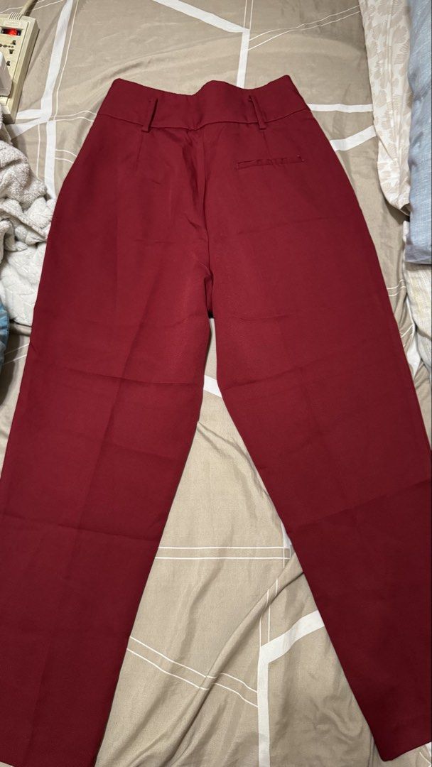 Forme Maroon Tailored Trousers Size S (Category: Jeans) located in San Pedro. Submitted by abbbnnn (Listing ID 1470414495, Image 2). Description: - Brand: Forme - Color: Maroon - Size: USA 4 | EUR 36 | UK 8 - Material: 89% Polyester, 11% Spandex (Comfortable stretch fabric) - Origin: Made in the Philippines - Style: High-waisted with front pleats, belt loops, and back pocket detail - Closure: Convenient side zipper.