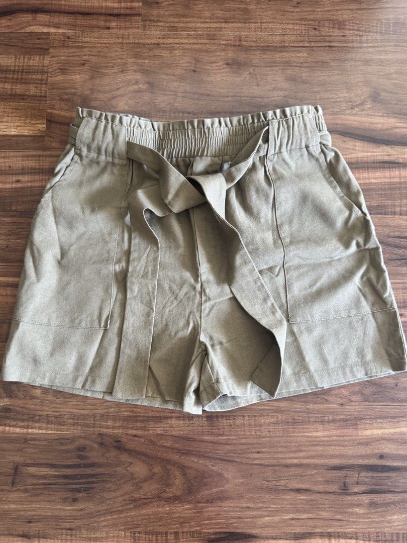 Forme Paperbag Shorts Olive Green Medium Linen Blend (Category: Shorts) located in Las Pinas. Submitted by gelbins (Listing ID 1470351263, Image 1). Description: - Brand: Forme - Size: Medium - Color: Olive green (Versatile neutral earth tone) - Material: 40% polyester, 35% viscose, 25% linen (Lightweight and breathable) - Features: Elastic high waist with matching tie belt and side pockets - Condition: Excellent/Ready to wear.
