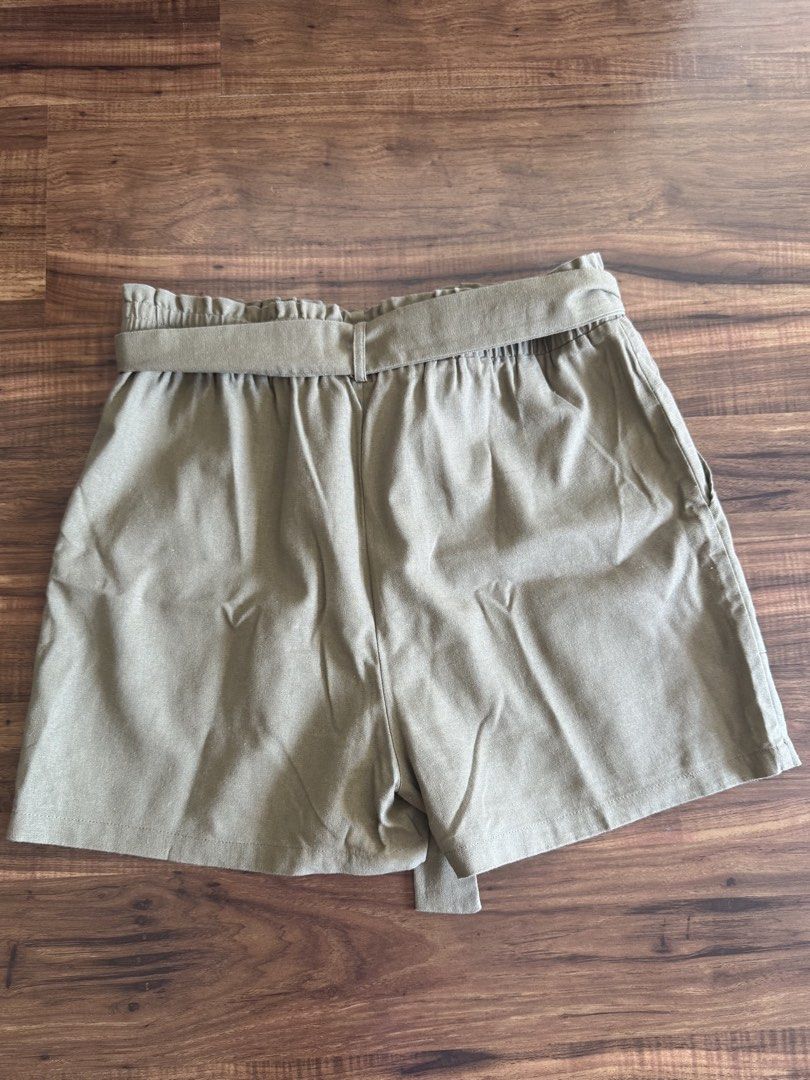 Forme Paperbag Shorts Olive Green Medium Linen Blend (Category: Shorts) located in Las Pinas. Submitted by gelbins (Listing ID 1470351263, Image 2). Description: - Brand: Forme - Size: Medium - Color: Olive green (Versatile neutral earth tone) - Material: 40% polyester, 35% viscose, 25% linen (Lightweight and breathable) - Features: Elastic high waist with matching tie belt and side pockets - Condition: Excellent/Ready to wear.