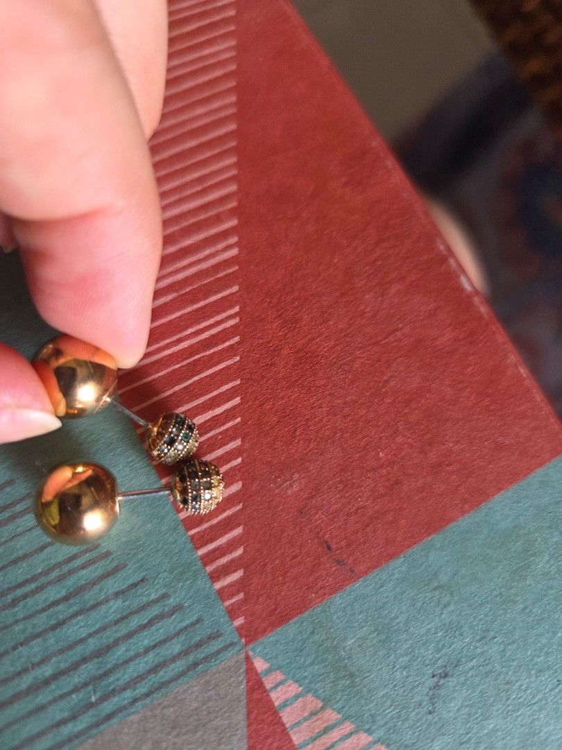 Fossil Double Sided Ball Earrings (Category: Earrings) located in Pasig City. Submitted by tatashki (Listing ID 1470374987, Image 2). Description: - Brand: Fossil - Color: Rose gold tone - Design: Versatile double-sided earrings (textured pavé ball on one side, smooth polished ball on the other) - Closure: Secure post back - Inclusion: Genuine Fossil packaging included - Condition:heavily used .Selling as is. Some crystals are missing, and the ar