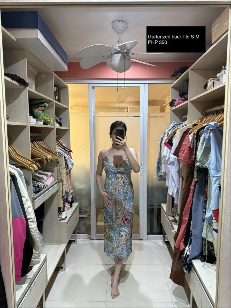 Free size maxi dress (Category: Dresses) located in Makati City. Submitted by thrift.plethora (Listing ID 1470490653, Image 3). Description: - Price: 350 PHP each - Option 1: Dark navy with floral pattern, free size - Option 2: Blue paisley print with garterized back, fits small to medium - Features: Spaghetti straps, easy throw-on style - Perfect for: Casual days out or vacations - Send a DM for any questions!.