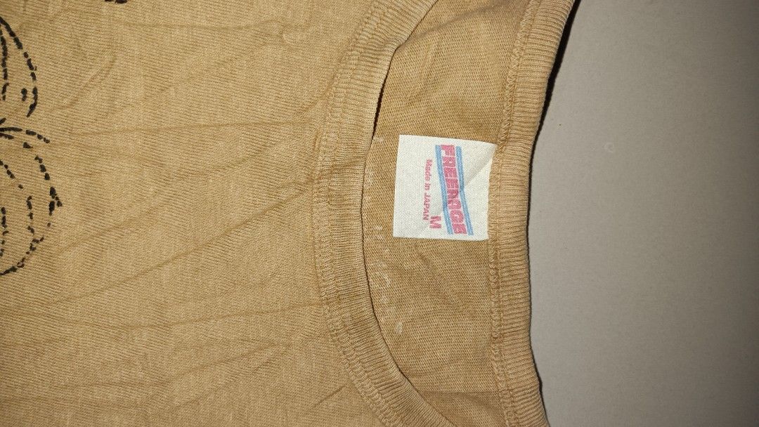 Freenage Brown Albert Einstein Graphic T-Shirt Size M (Category: Tshirts & Polo Shirts ) located in Davao. Submitted by 3stagethrifter (Listing ID 1470451705, Image 2). Description: - Brand: Freenage - Origin: Made in Japan - Size: Medium (tag on collar) - Color: Brown - Design: Albert Einstein graphic print with quote text on front - Details: Small woven label near bottom hem - Fit: Crew neck, short sleeves.