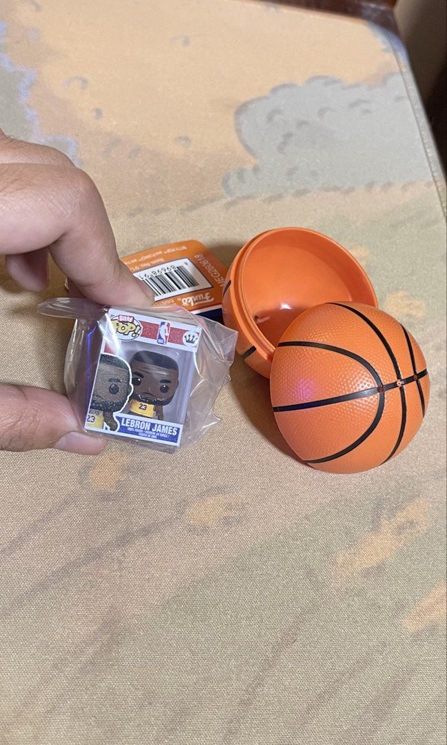 Funko Bitty Pop! NBA LeBron James (Category: Designer & Blind Box Toys) located in Davao. Submitted by chsktbc (Listing ID 1470382655, Image 1). Description: - Item: LeBron James Funko Bitty Pop figure - Packaging: Inside a basketball-shaped case and still sealed in original plastic - Inclusion: Comes with the small display box - Condition: Brand new and unopened - Perfect for: Basketball fans, NBA collectors, and Funko enthusiasts rfs: dupe.
