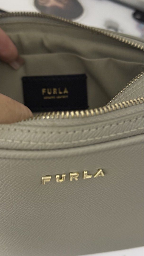 Furla Gray Leather Crossbody Bag (Category: Cross-body Bags) located in Makati City. Submitted by andrae.thomas (Listing ID 1470439067, Image 3). Description: - Brand: Furla - Style: Structured crossbody / camera bag - Strap not removable - Original with dustbag - Issue: with dried glue on the inside MAKATI AREA Meet Up: TAFT, Dlsu, CSB, Cash and Carry Fixed price.