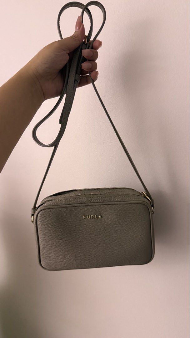 Furla Gray Leather Crossbody Bag (Category: Cross-body Bags) located in Makati City. Submitted by andrae.thomas (Listing ID 1470439067, Image 1). Description: - Brand: Furla - Style: Structured crossbody / camera bag - Strap not removable - Original with dustbag - Issue: with dried glue on the inside MAKATI AREA Meet Up: TAFT, Dlsu, CSB, Cash and Carry Fixed price.