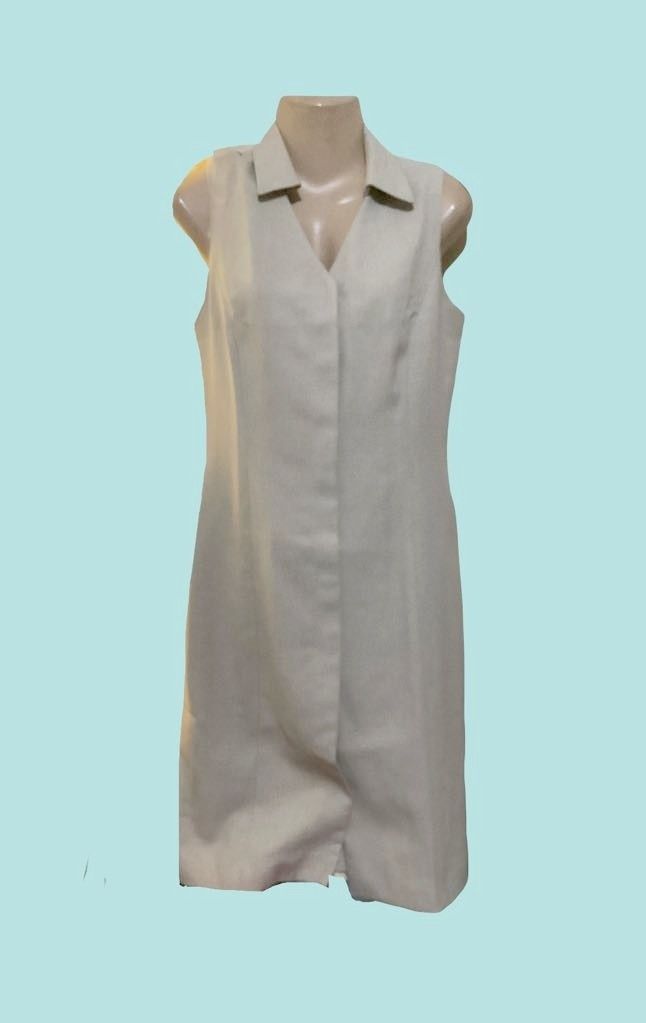 G2000 Beige Sleeveless Collar Dress (Category: Dresses) located in Paranaque City. Submitted by calm_youngstore7 (Listing ID 1470468947, Image 1). Description: - Condition: Brand new with original store tag attached - Color: Neutral beige with a contrasting pink inner lining - Design: Sleeveless, lapel collar, V-neckline, and stylish front slit at the hem - Fit: Structured silhouette that hits around knee length - Fabric: Linen-look material (lig