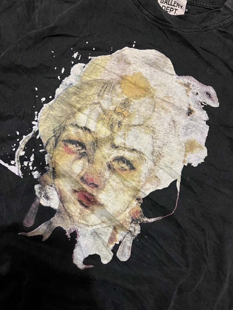 Gallery Dept. Graphic Tee Alone In Silence Black (Category: Tshirts & Polo Shirts ) located in Manila. Submitted by adzwilnams67005 (Listing ID 1470499686, Image 3). Description: - Brand: Gallery Dept. - Color: Washed black - Design: Front artistic portrait with white paint splatter; back layered 'Alone In Silence' lettering in red and metallic gold - Details: Woven brand neck tag with side size tab - Fit: Regular fit with heavy wash fabric style