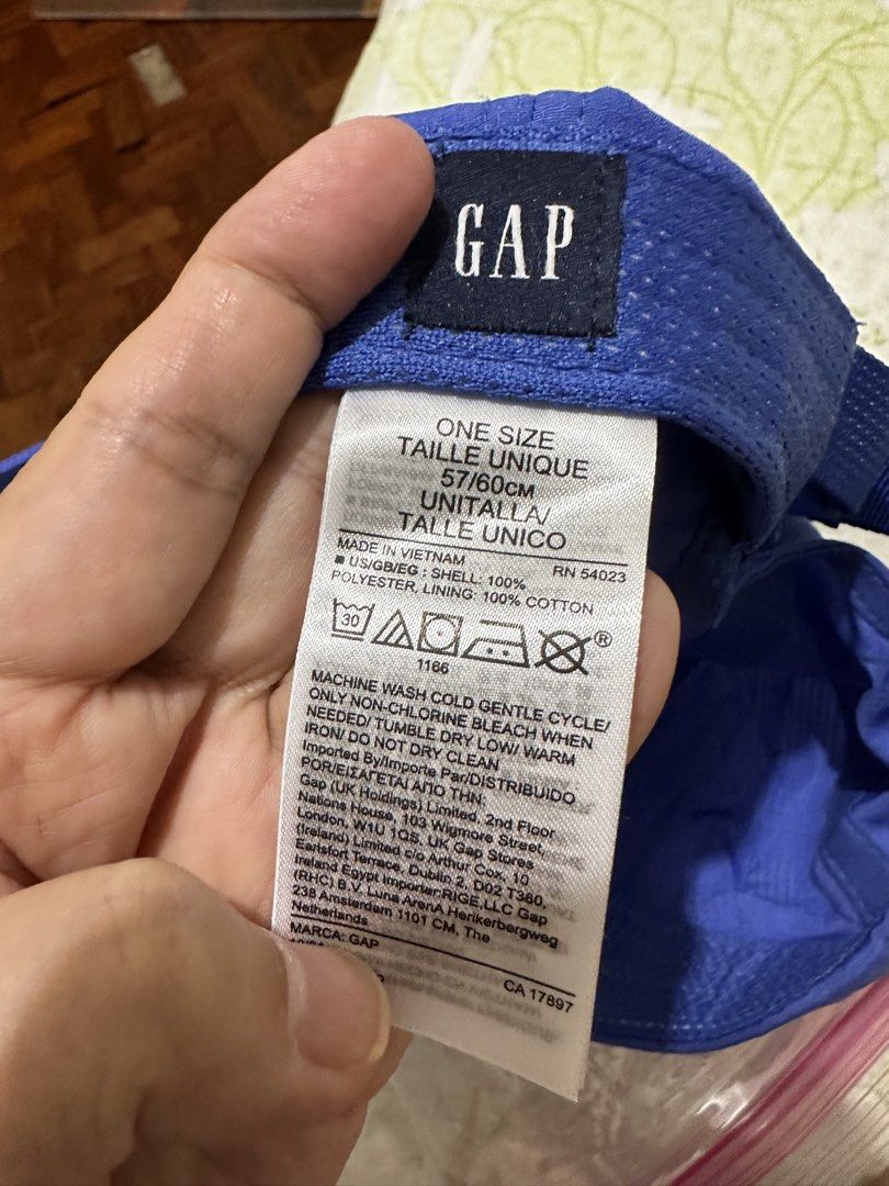 GAP Blue Baseball Cap Adjustable Ripstop Hat (Category: Caps & Hats) located in Balanga. Submitted by jamilbeauty5 (Listing ID 1470463784, Image 2). Description: - Brand: GAP - Color: Blue - Material: 100% polyester ripstop with cotton lining - Design: Embroidered GAP logo on the front - Fit: One size fits most with an adjustable strap at the back - Origin: Made in Vietnam - Care: Machine washable - GUARANTEED AUTHENTIC! .
