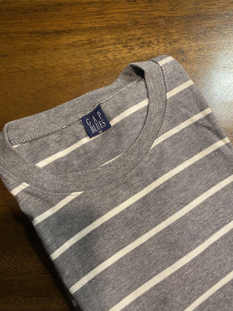 Gap Blues Striped Grey T-Shirt Size M (Category: Tshirts & Polo Shirts ) located in Pasay City. Submitted by islaaxo (Listing ID 1470433521, Image 1). Description: - Brand/Style: Gap Blues grey t-shirt with classic white horizontal stripes - Neckline & Sleeves: Crew neck and short sleeves - Size: Medium (M) - Comfort: Made with soft, comfortable fabric ideal for daily wear - Versatility: Easy to pair with your favorite casual denim or shorts.