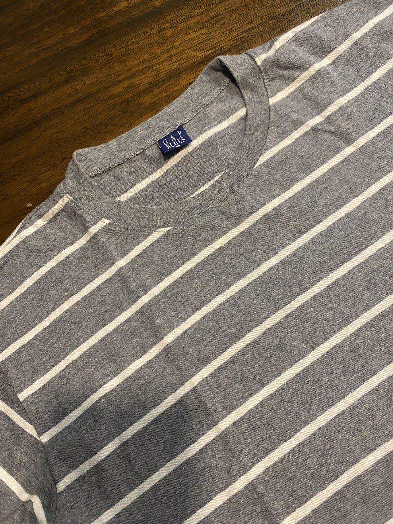 Gap Blues Striped Grey T-Shirt Size M (Category: Tshirts & Polo Shirts ) located in Pasay City. Submitted by islaaxo (Listing ID 1470433521, Image 2). Description: - Brand/Style: Gap Blues grey t-shirt with classic white horizontal stripes - Neckline & Sleeves: Crew neck and short sleeves - Size: Medium (M) - Comfort: Made with soft, comfortable fabric ideal for daily wear - Versatility: Easy to pair with your favorite casual denim or shorts.