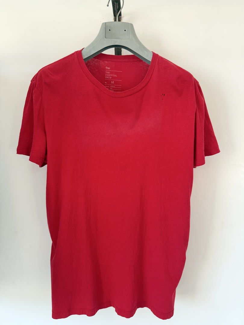 Gap The Essential Crew Red T-Shirt Size M (Category: Shirts) located in Quezon City. Submitted by satisfied_buyer (Listing ID 1470554727, Image 1). Description: - Brand/Item: Gap The Essential Crew T-Shirt - Color: Bright Red - Size: Medium (Regular Fit) - Material: 100% Cotton - Origin: Made in Vietnam - Style Code: 767861 - Condition Note: Has small holes near the collar on the front left chest Decluttering Shoulders 47m Chest 48m Length 70m.
