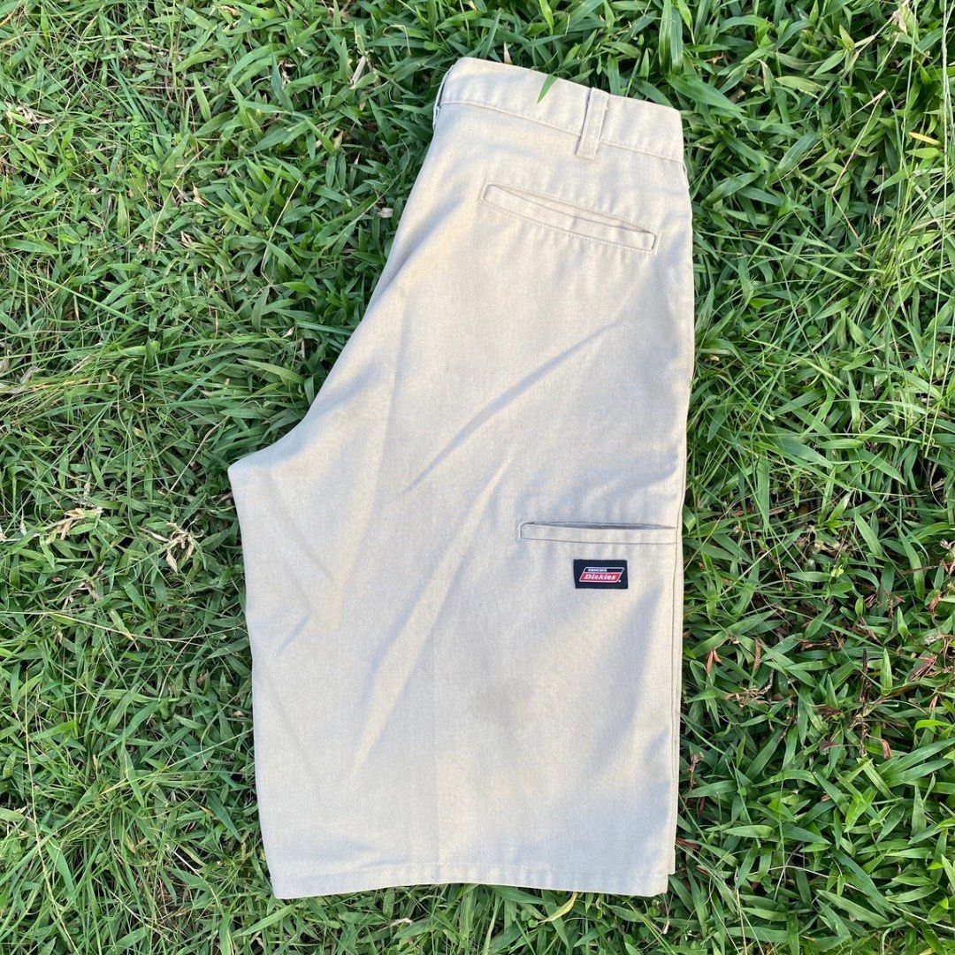 Genuine Dickies Khaki Shorts (Category: Shorts) located in Butuan. Submitted by gardenofjayden (Listing ID 1470445889, Image 2). Description: - Brand: Genuine Dickies - Color: Classic tan / khaki - Material: Sturdy cotton twill - Features: Front pockets, back welt pockets, button closure, and logo patch on left hem - Condition: Clean overall finish - Style: Casual warm-weather staple - Needs Wash.