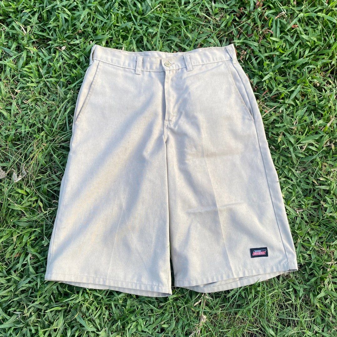 Genuine Dickies Khaki Shorts (Category: Shorts) located in Butuan. Submitted by gardenofjayden (Listing ID 1470445889, Image 1). Description: - Brand: Genuine Dickies - Color: Classic tan / khaki - Material: Sturdy cotton twill - Features: Front pockets, back welt pockets, button closure, and logo patch on left hem - Condition: Clean overall finish - Style: Casual warm-weather staple - Needs Wash.