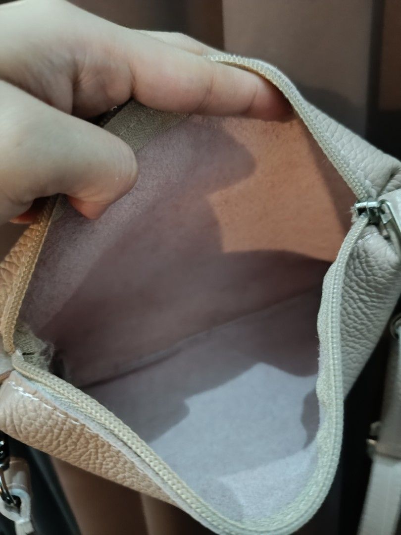 Genuine Leather Italy Sling bag (Category: Cross-body Bags) located in General Mariano Alvarez. Submitted by plsjewelryemporium (Listing ID 1470471901, Image 2). Description: Genuine Leather Italy sling bag adjustable strap light beige color mabango (real leather smell) from Greece pwede sa maselan PHP 1,100 + SF MOP: Gcash MOD: J&t express and lalamove NO COD/COP.
