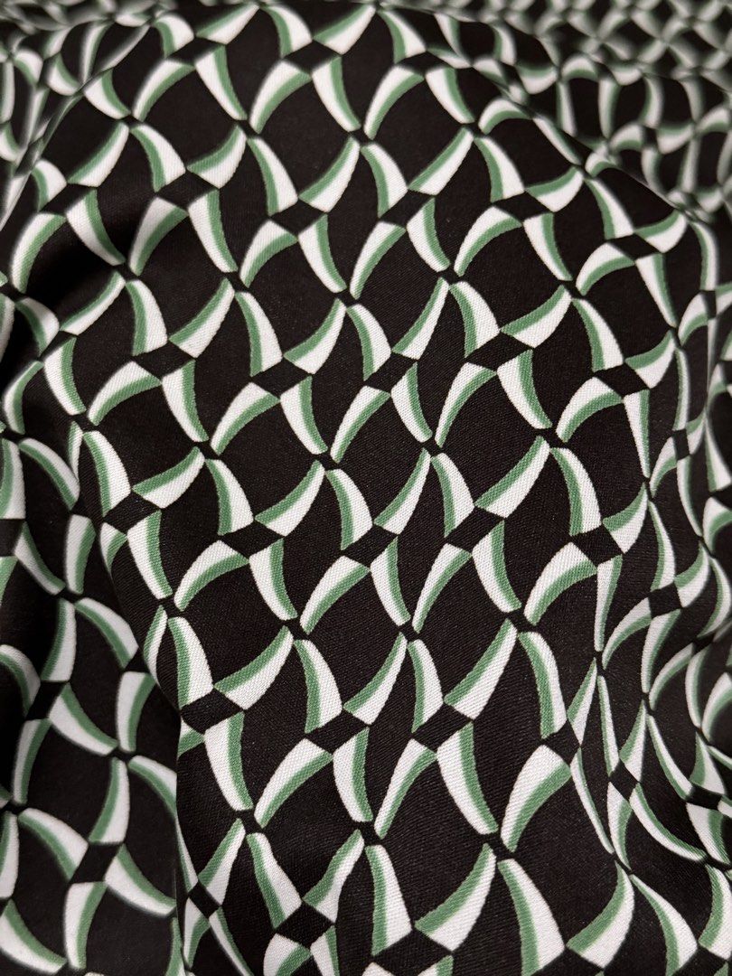 Geometric Pattern Midi Skirt Green Black White (Category: Skirts) located in Angeles City. Submitted by m1lkramen (Listing ID 1470471192, Image 3). Description: - Style: Geo-print midi skirt with subtle trim detail at the waistband - Colors: Green, black, and white - Fit: Mid-rise, flattering A-line cut falling below the knee - Fabric: Smooth material with a nice drape - Versatility: Perfect for work or weekends; easy to pair with plain tops or c