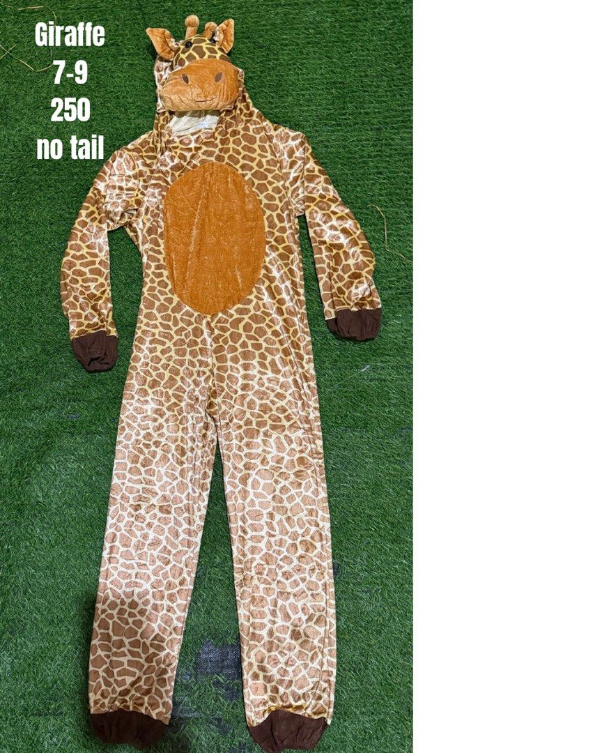 Giraffe Animal Onesie Costume (Category: Babies & Kids Fashion) located in San Fernando. Submitted by InvisibleMe (Listing ID 1470454834, Image 1). Description: - Adorable giraffe costume onesie for kids (fits approx. 7-9 years old) - Full-length brown and tan giraffe print with a lighter belly patch - Attached hood complete with cute giraffe face and ears - Comfortable brown cuffs on sleeves and ankles - Condition note: Missing the tail.