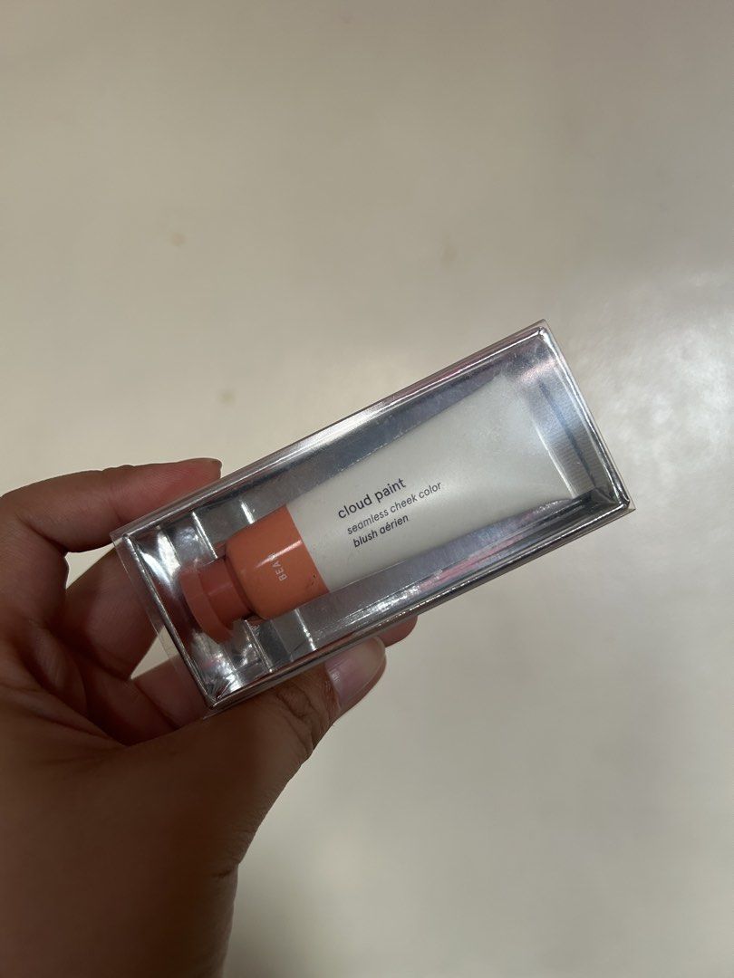 Glossier Cloud Paint in Beam (Category: Makeup) located in Cavite. Submitted by mgmm17 (Listing ID 1470353587, Image 1). Description: - Shade: Beam (Soft Peach) - Size: 0.33 fl oz / 10 ml tube - Condition: Brand new, unopened, still sealed in original box - Formula: Seamless gel-cream cheek color - Details: Cruelty-free, made in the USA - How to use: Squeeze a tiny dot and blend onto cheeks.