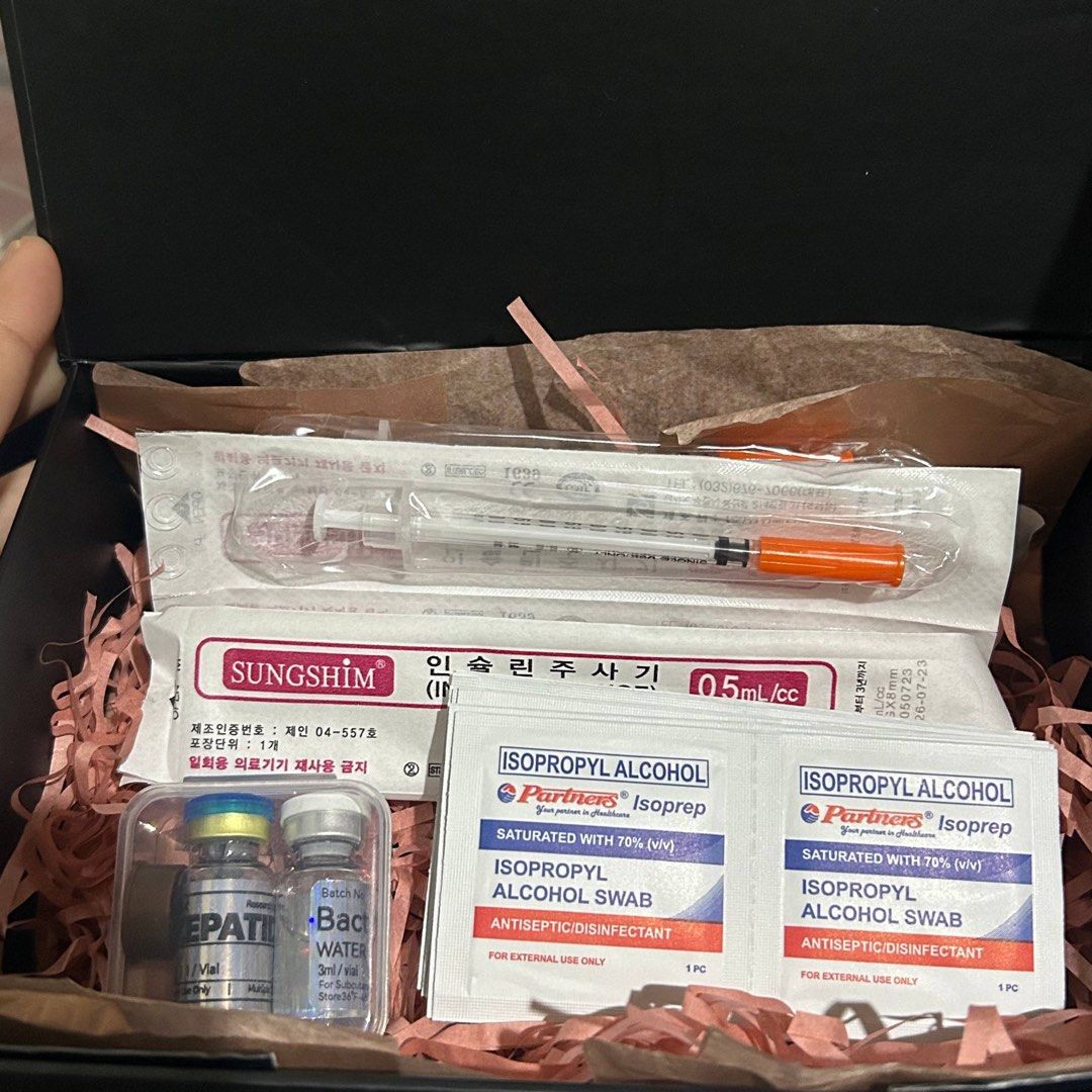 Tirzepatide (Category: Medical Supplies & Tools) located in Quezon City. Submitted by garayaljon86768 (Listing ID 1470475694, Image 1). Description: - Brand: Glowdose - Packaging: Elegant black gift box lined with shredded pink paper - Includes Sungshim 0.5ml insulin syringes - Includes Partners Isoprep isopropyl alcohol swabs - Comes with a bacteriostatic water vial and an additional labeled vial - Neatly arranged and ready to use.
