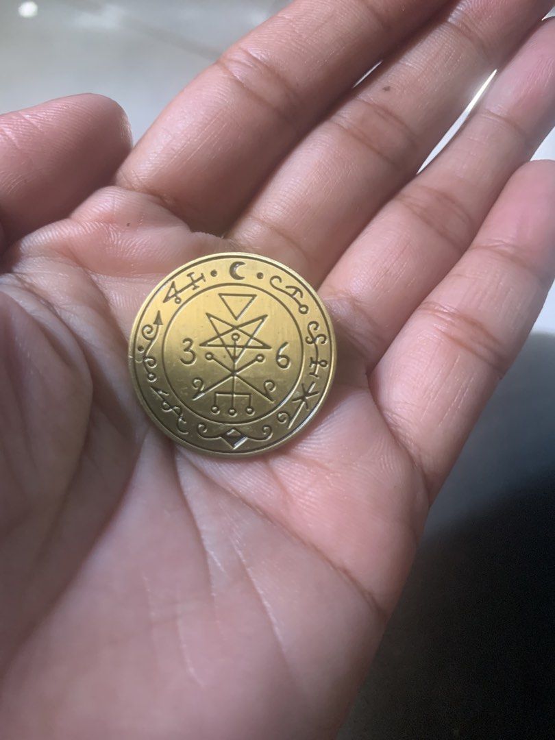 Gold tone esoteric pentagram lapel pin badge (Category: Brooches) located in Valenzuela. Submitted by diane.35 (Listing ID 1470399669, Image 1). Description: - Design: Round metal badge with esoteric symbols, a star, and numbers 3 and 6 - Finish: Elegant gold tone with textured dark backing - Fastener: Secure butterfly clutch pin back on the reverse - Versatile: Great for styling jackets, bags, backpacks, or hats - Condition: Brand new and ready 