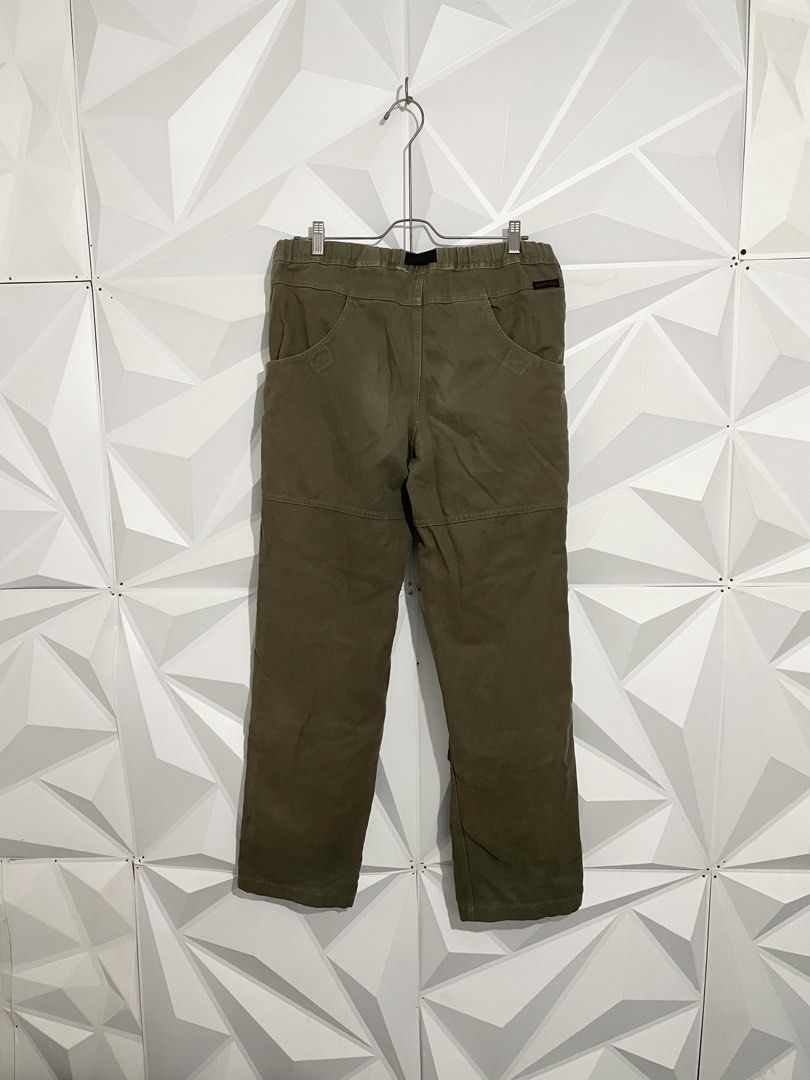 Gramicci Olive Green Canvas Double Knee Pants (Category: Trousers) located in Cabuyao City. Submitted by ParadisethriftedPh (Listing ID 1470547072, Image 3). Description: Cr:9/10 Dimensions W: 34-36 L: 41 - Brand: Gramicci - Color: Olive Green - Material: Sturdy canvas with reinforced knee panels - Fit: Relaxed straight leg - Waist: Elastic waistband with adjustable black webbed belt and buckle closure - Pockets: Deep front pockets and rear pocke