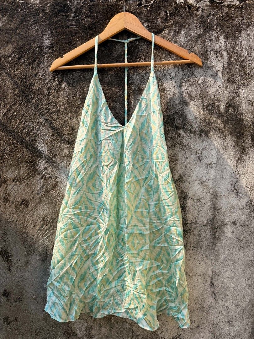 Green and Yellow Patterned Halter Dress (Category: Dresses) located in Batangas. Submitted by vintagesyndicate2 (Listing ID 1470426545, Image 1). Description: - Color/Print: Green and yellow printed - Style: Halter dress with V-neckline and thin back straps - Fit: Relaxed, light, and flowy - Material: Lightweight fabric, easy slip-on wear - Best For: Beach trips, vacations, and warm weather.