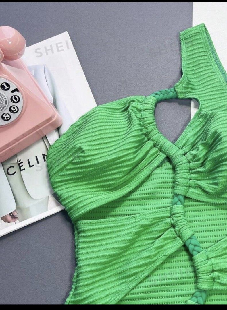 Green One-Shoulder Cut-Out Ribbed Swimsuit (Category: Bikinis & Swimsuits) located in Taguig. Submitted by marj.palomo (Listing ID 1470491348, Image 2). Description: - Condition: Used once only - Color: Vibrant bright green - Material: Textured ribbed fabric - Design: Asymmetric one-shoulder strap with braided ring details - Details: Trendy cut-outs at the waist and chest with a flattering high-cut leg - Perfect for: Beach days, vacations, and po