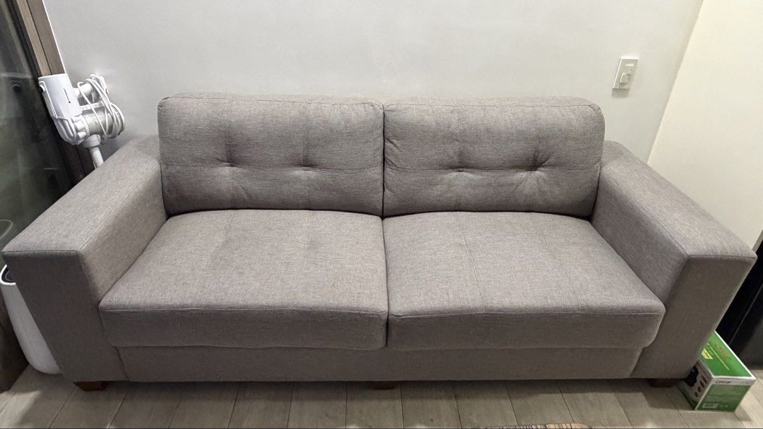 Grey 3-Seater Fabric Sofa (Category: Sofas) located in Manila. Submitted by emchi19 (Listing ID 1470463153, Image 1). Description: - Length: 86 cm. Width: 210 cm. - Color: grey - Type: 3 seater grey fabric sofa - Design: Grey colour with chic tufted button details and wide armrests - arrange for your own pick up at SM WIND TOWER 3 Tagaytay (ex. Lalamove or your own transportation).