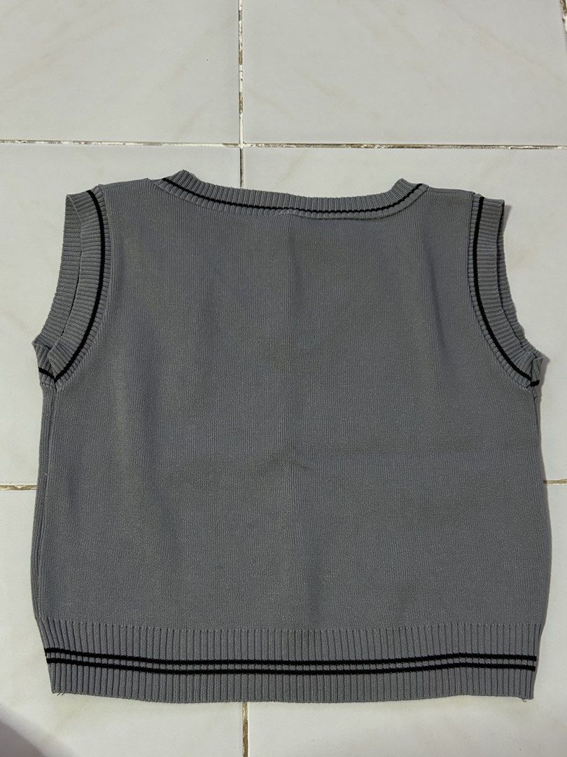 Grey V-Neck Knit Sweater Vest (Category: Sleeveless) located in Manila. Submitted by viyyu (Listing ID 1470417029, Image 3). Description: •V-neck, ribbed knit material •Classic preppy, versatile layering piece •knitted, not too thin, not too thick •semi cropped .