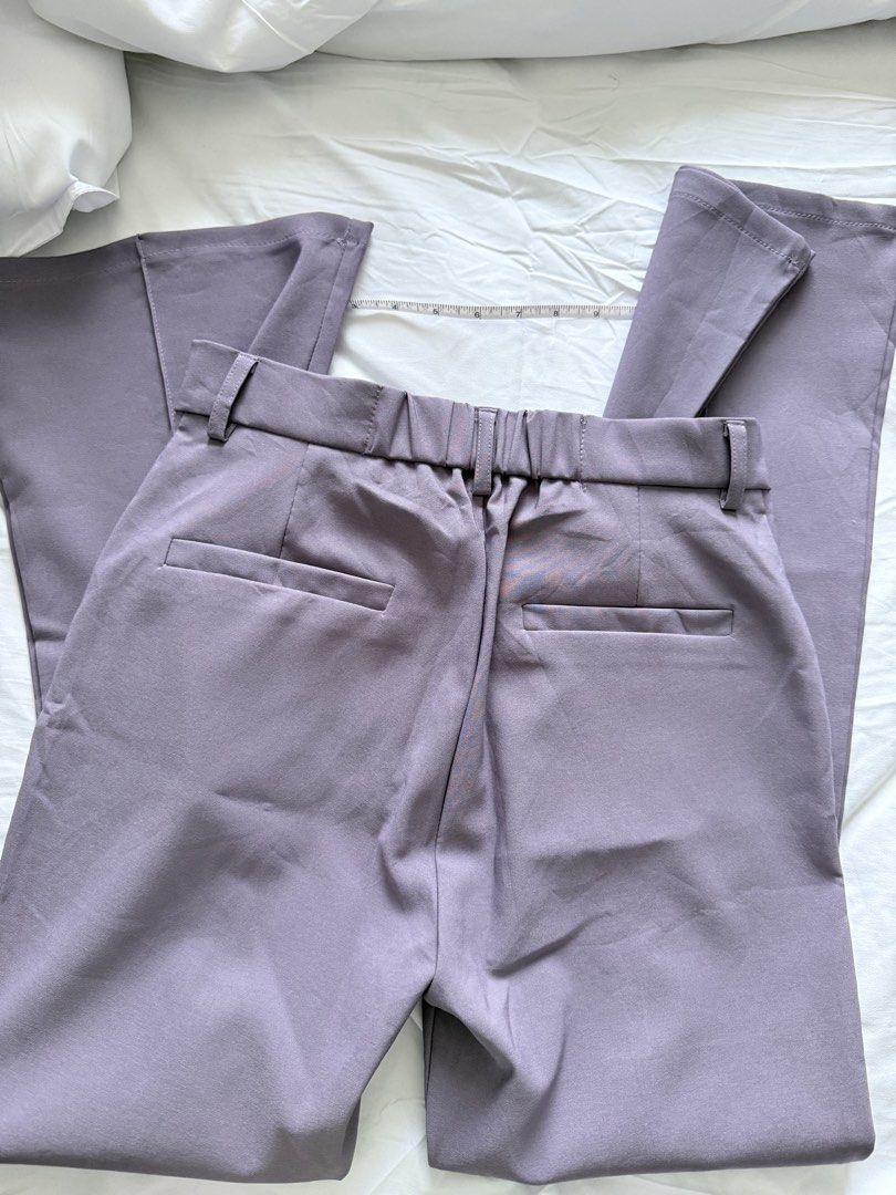 GRL Purple Slit Hem Trousers Size L (Category: Jeans) located in Mandaluyong City. Submitted by chi11ng (Listing ID 1470483087, Image 3). Description: - Brand: GRL - Size: L (Tag: Waist 66-71cm, Hip 89-95cm, Height 160-166cm) - Color: Purple - Material: 95% Polyester, 5% Polyurethane - Waist: ~13.5 inches across flat with back elastic & belt loops - Design: Front crease on each leg with trendy split cuffs - Pockets: Two back pockets - Condition: 