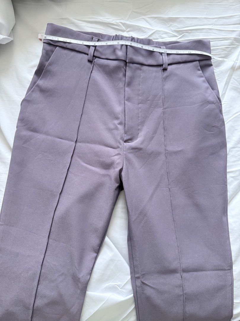 GRL Purple Slit Hem Trousers Size L (Category: Jeans) located in Mandaluyong City. Submitted by chi11ng (Listing ID 1470483087, Image 2). Description: - Brand: GRL - Size: L (Tag: Waist 66-71cm, Hip 89-95cm, Height 160-166cm) - Color: Purple - Material: 95% Polyester, 5% Polyurethane - Waist: ~13.5 inches across flat with back elastic & belt loops - Design: Front crease on each leg with trendy split cuffs - Pockets: Two back pockets - Condition: 