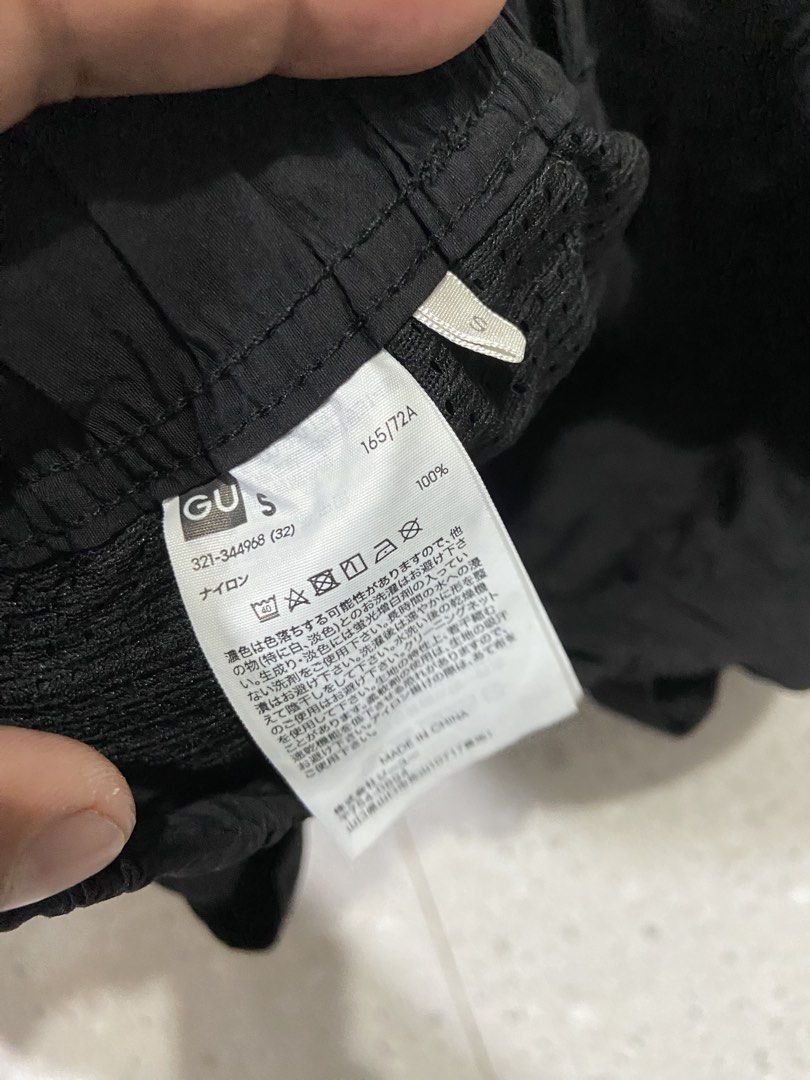 GU Black Nylon Cargo Shorts Size S (Category: Shorts) located in Calumpit. Submitted by Ketchi (Listing ID 1470498552, Image 2). Description: - Brand: GU - Color: Black - Material: 100% lightweight nylon - Size: S (165/72A) - Features: Built-in adjustable webbing belt with buckle, elastic waistband, and two secure zippered side pockets - Condition: Clean interior with tags intact - Ideal for: Outdoor activities and casual wear.