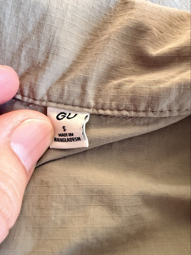 GU Polo Nylon Zip up Beige (Category: Tshirts & Polo Shirts ) located in Pasig City. Submitted by thetravellingguyinstyle (Listing ID 1470439446, Image 3). Description: - Brand: GU - Item: Utility Shirt / Overshirt - Color: Beige - Size: Small - Material: Durable nylon fabric texture - Features: Short sleeves, front full zip closure, pointed collar, and a chest pocket with zipper detail - Condition: Like New; Excellent casual everyday wear.