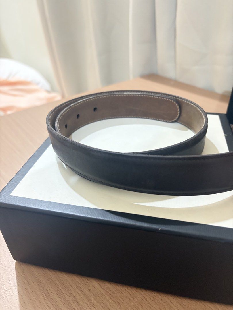 Gucci Bamboo Buckle Leather Belt (Category: Belts) located in Iloilo. Submitted by miafinds (Listing ID 1470386672, Image 3). Description: - Brand: Authentic Gucci - Color: Dark brown leather with tan interior lining - Hardware: Distinctive gold-tone bamboo-style metal buckle with engraved Gucci branding - Condition: Excellent, stored in original presentation box - Style: Versatile designer accessory perfect for everyday wear.