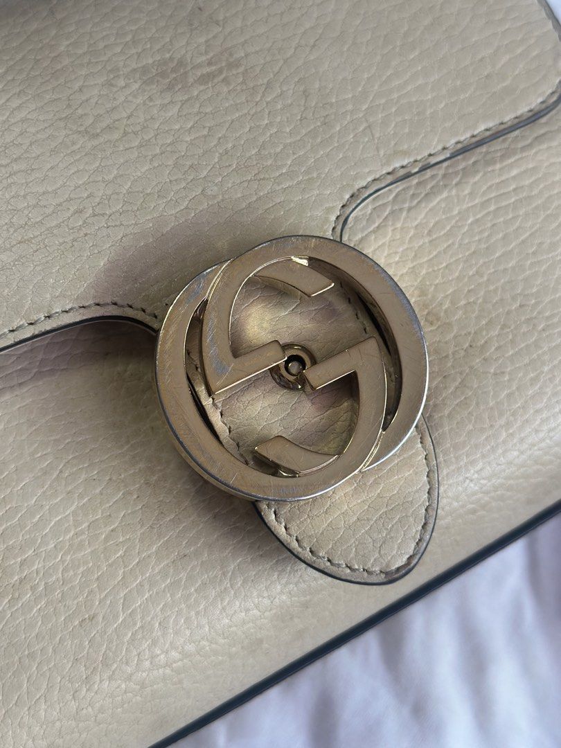 Gucci Beige Leather Shoulder Bag with Interlocking G (Category: Luxury Bags & Wallets) located in Manila. Submitted by itsajiii (Listing ID 1470356644, Image 2). Description: Gucci Interlocking G chain Dollar Calfskin leather in Beige color - multiple interior compartments - original Gucci product care card Condition: Pre-loved with minor scuffs on leather corners and scratches on hardware (can still be restored, needs cleaning) Selling price ₱50