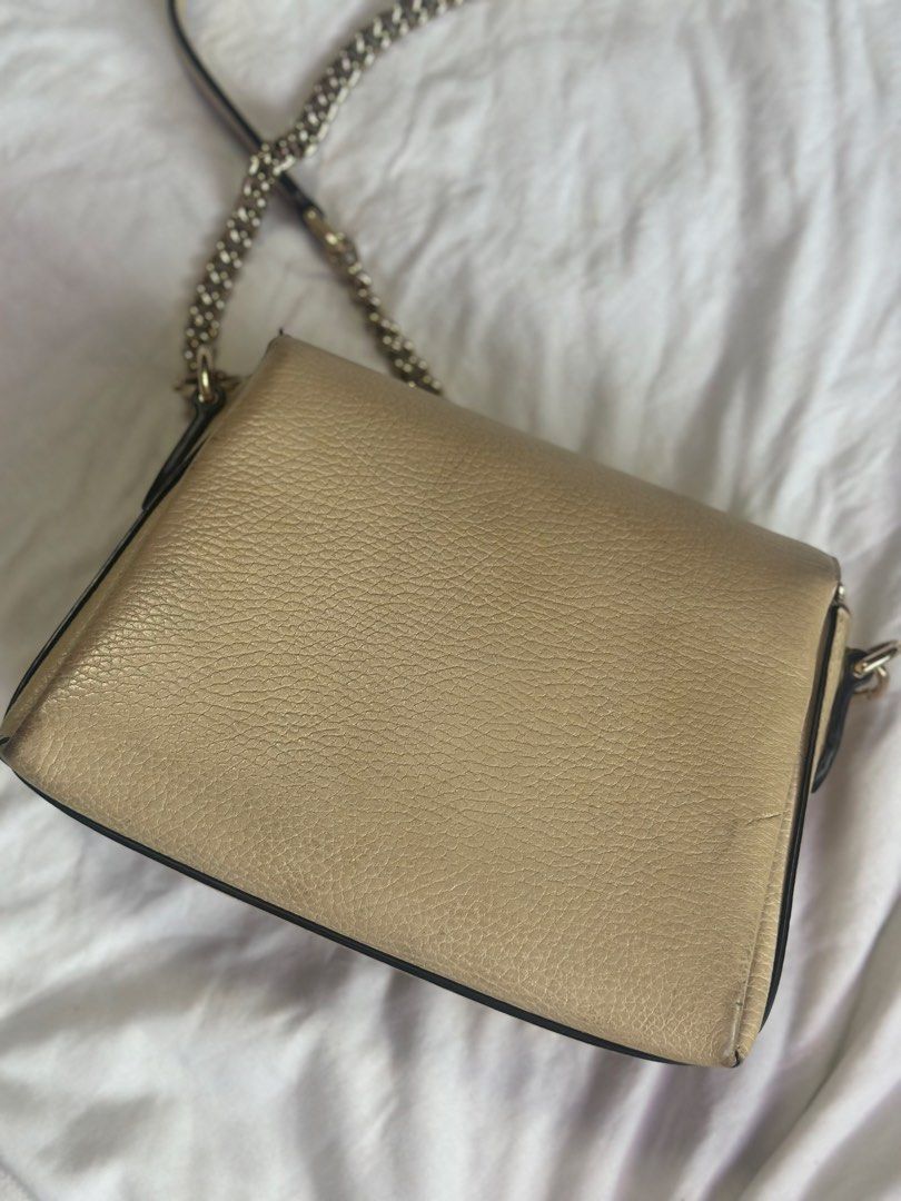 Gucci Beige Leather Shoulder Bag with Interlocking G (Category: Luxury Bags & Wallets) located in Manila. Submitted by itsajiii (Listing ID 1470356644, Image 3). Description: Gucci Interlocking G chain Dollar Calfskin leather in Beige color - multiple interior compartments - original Gucci product care card Condition: Pre-loved with minor scuffs on leather corners and scratches on hardware (can still be restored, needs cleaning) Selling price ₱50