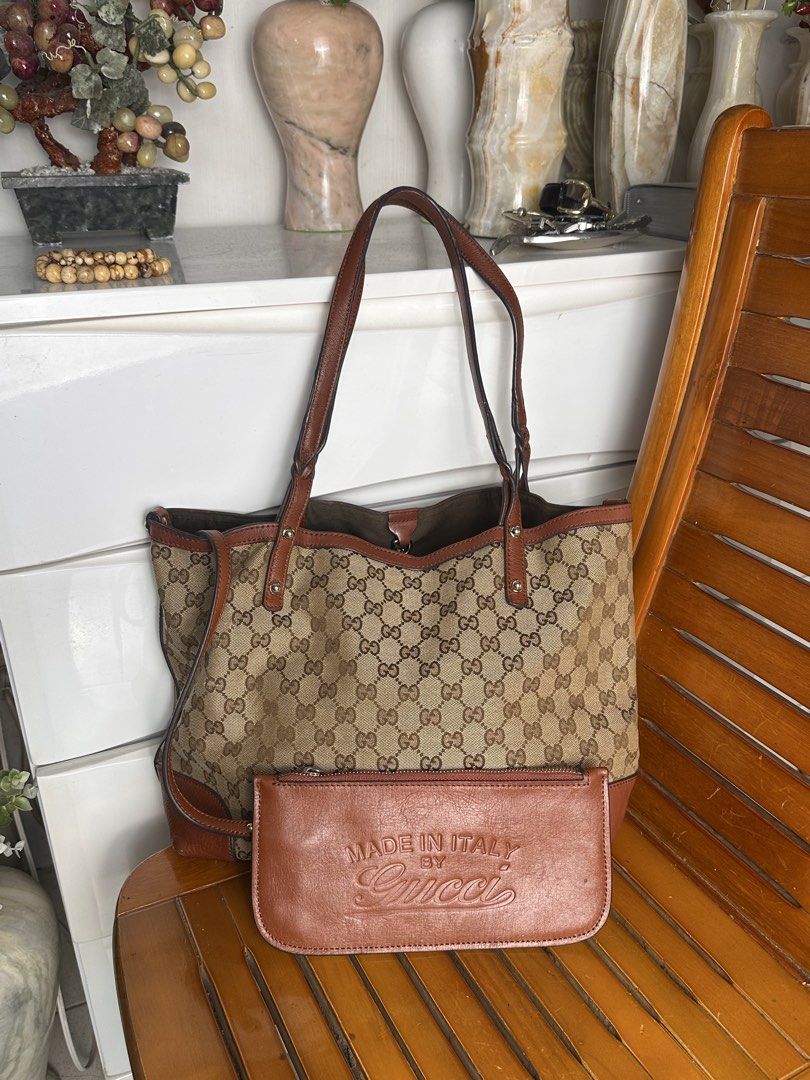 Gucci GG Canvas Tote Bag Brown (Category: Tote Bags) located in Santa Rosa. Submitted by shop818 (Listing ID 1470412130, Image 1). Description: - Gucci GG monogram canvas tote bag (searchable code) - Elegant brown leather trim and silver-tone hardware with brand engravings - Comfortable double shoulder straps for easy wear - Spacious brown fabric-lined interior for all your daily essentials - Includes a matching leather pouch embossed with 'Made 