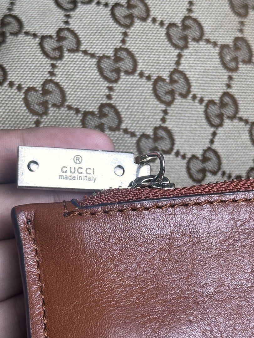 Gucci GG Canvas Tote Bag Brown (Category: Tote Bags) located in Santa Rosa. Submitted by shop818 (Listing ID 1470412130, Image 3). Description: - Gucci GG monogram canvas tote bag (searchable code) - Elegant brown leather trim and silver-tone hardware with brand engravings - Comfortable double shoulder straps for easy wear - Spacious brown fabric-lined interior for all your daily essentials - Includes a matching leather pouch embossed with 'Made 