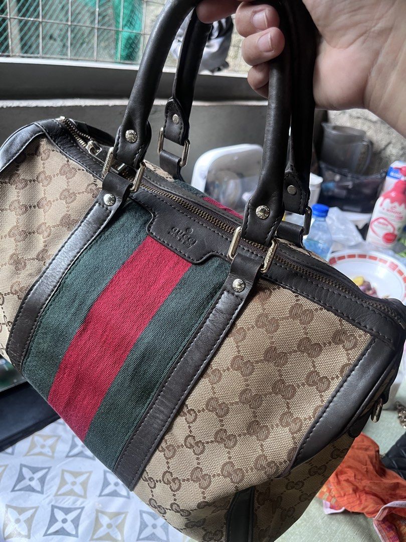Gucci GG Canvas Web Boston Bag No Sling Strap (Category: Luxury Bags & Wallets) located in Manila. Submitted by madecuratedwithlove11 (Listing ID 1470428399, Image 1). Description: - Gucci Boston bag in beige GG canvas - ISSUE: no sling strap - Iconic red and green web stripe detail - Durable brown leather trim and dual top handles - Secure top zip closure with gold-tone hardware - Spacious fabric-lined interior with extra zip pocket - Made in It