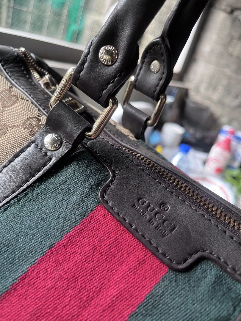 Gucci GG Canvas Web Boston Bag No Sling Strap (Category: Luxury Bags & Wallets) located in Manila. Submitted by madecuratedwithlove11 (Listing ID 1470428399, Image 2). Description: - Gucci Boston bag in beige GG canvas - ISSUE: no sling strap - Iconic red and green web stripe detail - Durable brown leather trim and dual top handles - Secure top zip closure with gold-tone hardware - Spacious fabric-lined interior with extra zip pocket - Made in It